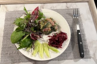 petite spinach, prociutto and potato cake with dressed leaves